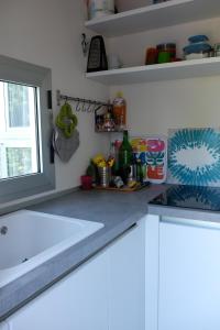 a kitchen counter with a sink and a window at Acqua Dolce in Rio Marina +38 photos