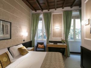 A bed or beds in a room at DK Suites