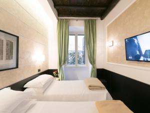 A bed or beds in a room at DK Suites