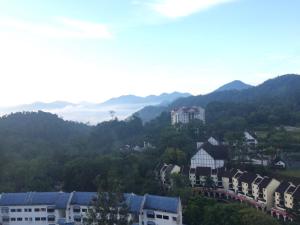 a view of a town with mountains in the background at 2 bed Kempas D2-705 Genting Highland in Genting Highlands