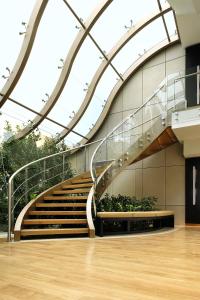 
a staircase leading up to a balcony with a view of a building at Daios Luxury Living in Thessaloniki
