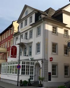 a white building on the corner of a street at Rheinhotel St. Goar in Sankt Goar