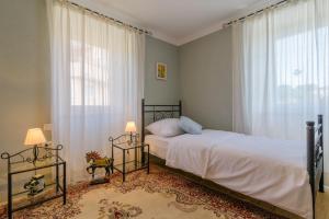 a bedroom with two beds and a large window at Villa Andante in Trogir +41 photos
