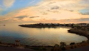 a view of a body of water at sunset at Hotel Giglio in Lampedusa