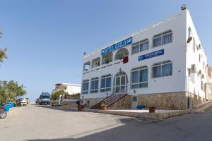 a white building on the side of a street at Hotel Giglio in Lampedusa