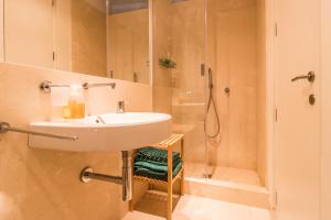a bathroom with a sink and a shower at Belle Arti in Bergamo +82 photos