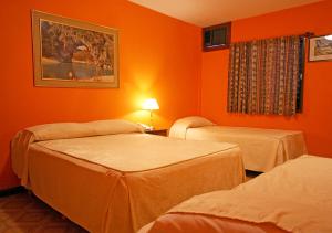 Кровать или кровати в номере Costa Azul Hotel