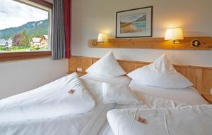 Letto o letti in una camera di Wiesenhof, Hotel direkt am See
