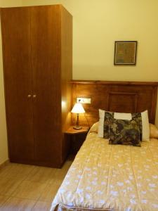 Postel nebo postele na pokoji v ubytování Hostal Loreto