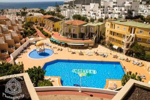 an aerial view of a resort with a swimming pool at Orlando Apartment in Adeje