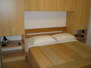 מיטה או מיטות בחדר ב-Apartmani Danica