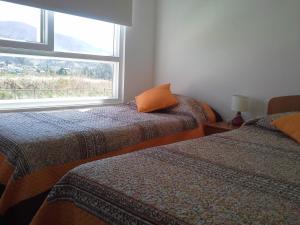 Postel nebo postele na pokoji v ubytování Lomas Papudo 4