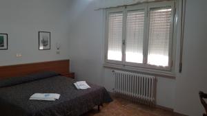 Postel nebo postele na pokoji v ubytování Albergo Sonia