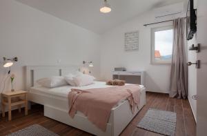 Cama o camas de una habitación en Kvasina Apartments