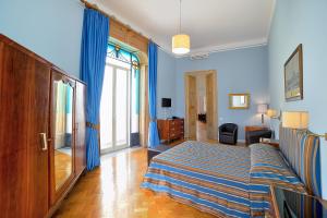 A bed or beds in a room at Spaccanapoli Comfort Suites
