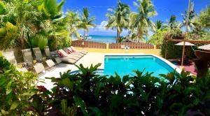 Bazén v ubytování Caye Reef Condos nebo v jeho okolí
