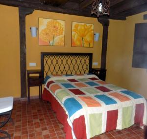 Cama o camas de una habitación en Casas Rurales Lagunas de Ruidera - Piscina