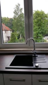 Kuchyňa alebo kuchynka v ubytovaní Apartament rodzinny z ogrodem - Bliżej Zdroju + 37 fotografií