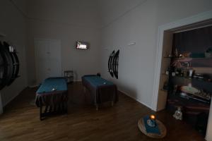 Televízia a/alebo spoločenská miestnosť v ubytovaní B&B BORGO FORNACI