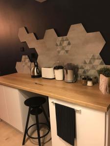 a kitchen counter with pots and pans on it at Black Rose APARTAMENT Targi 3 km, F-ry Vat in Kielce