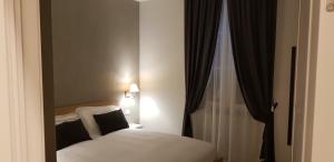 Postel nebo postele na pokoji v ubytování Bed Milano Linate