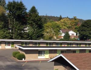 arial view of a building with a parking lot at Motel 88 in Oneonta