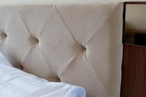 Postel nebo postele na pokoji v ubytování Jijo's Hotel