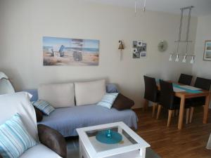 a living room with a couch and a table at Seestern in Dahme