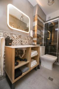 Ένα μπάνιο στο Artemis Apartments +21 φωτογραφίες