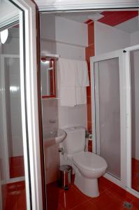 a bathroom with a toilet and a sink at Hotel Serdica in Silistra