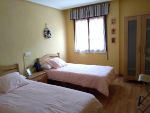 Postel nebo postele na pokoji v ubytování Los pisos de Pin