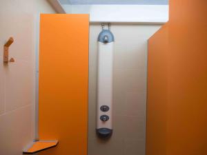 a bathroom with a shower stall with a window at Alberg Olot Xanascat in Olot