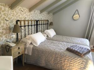 Ένα ή περισσότερα κρεβάτια σε δωμάτιο στο Casa das Veigas +26 φωτογραφίες