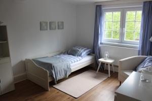 Ένα ή περισσότερα κρεβάτια σε δωμάτιο στο Zuhause mit nordischen Charme