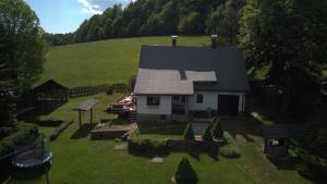 an aerial view of a house in a field at Chalupa Podhradí in Jiřetín pod Jedlovou +25 photos