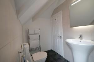 A bathroom at One Helena Road Serviced Apartments 