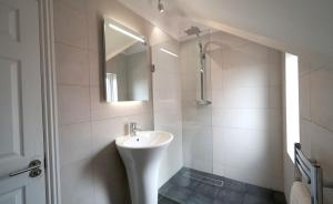 A bathroom at One Helena Road Serviced Apartments 