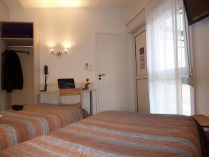 En eller flere senger på et rom på Charme Hotel en Beaujolais