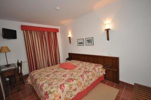 Un pat sau paturi într-o cameră la Casa do Preto