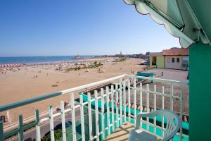 a view of the beach from a balcony of a beach at Hotel Sanremo in Caorle