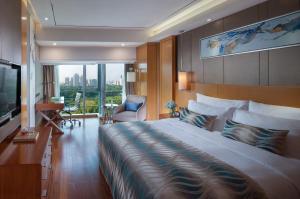 Televízia a/alebo spoločenská miestnosť v ubytovaní Sentosa Hotel Apartment Taoyuan Branch