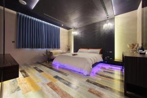Postel nebo postele na pokoji v ubytování Chen He Motel