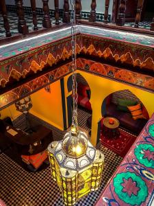 a chandelier hanging from the ceiling of a room at Tangiers Hostel in Tangier