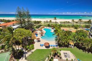 an aerial view of a resort with a pool and the beach at Blue Ocean Apartment in Gold Coast