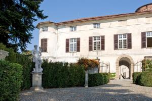 a statue in front of a building at Castello di Rocca Grimalda in Rocca Grimalda