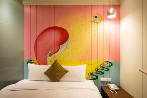 Rúm í herbergi á Merryday Hotel Banqiao