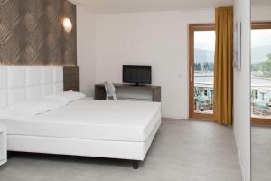 Posteľ alebo postele v izbe v ubytovaní Exclusive Suites Riva