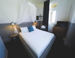 Postel nebo postele na pokoji v ubytování Hotel Palisade