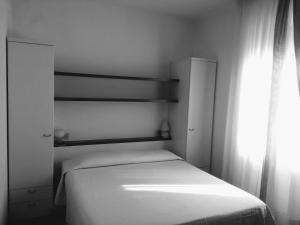 Postel nebo postele na pokoji v ubytování B&B da AnnaMaria