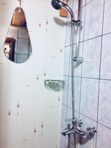 a bathroom with a shower with a mirror at Karelskaya Usadba Hotel Complex in Shuya